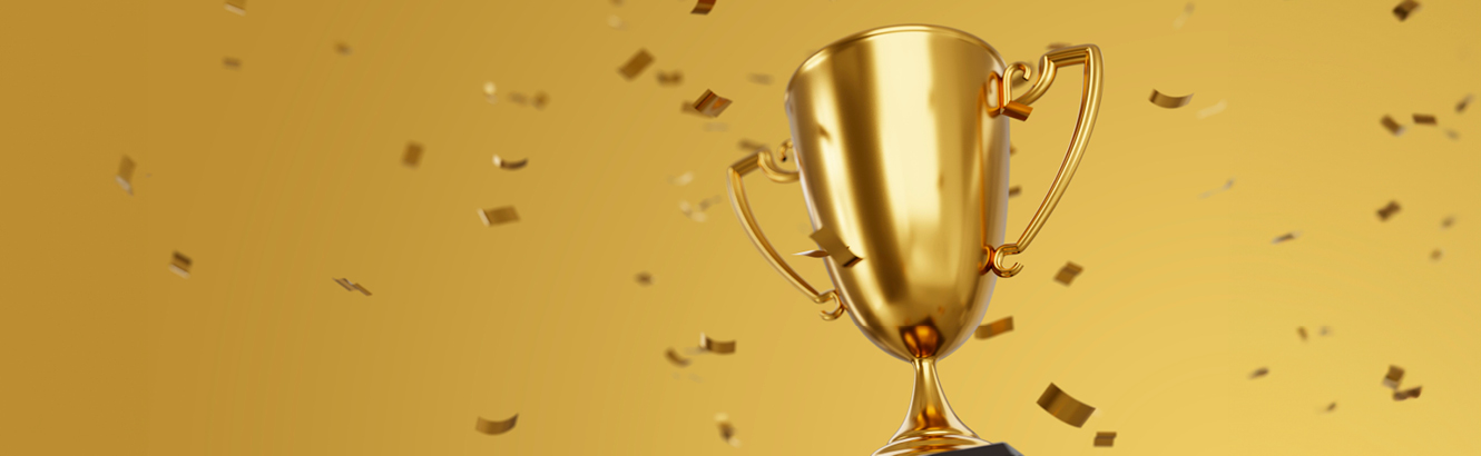 A gold trophy surrounded by gold confetti